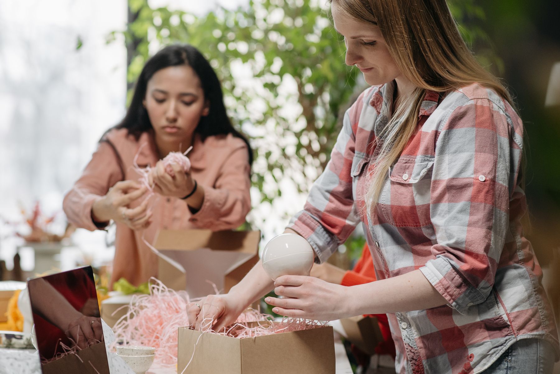 Store operators packing online orders and commerce materials